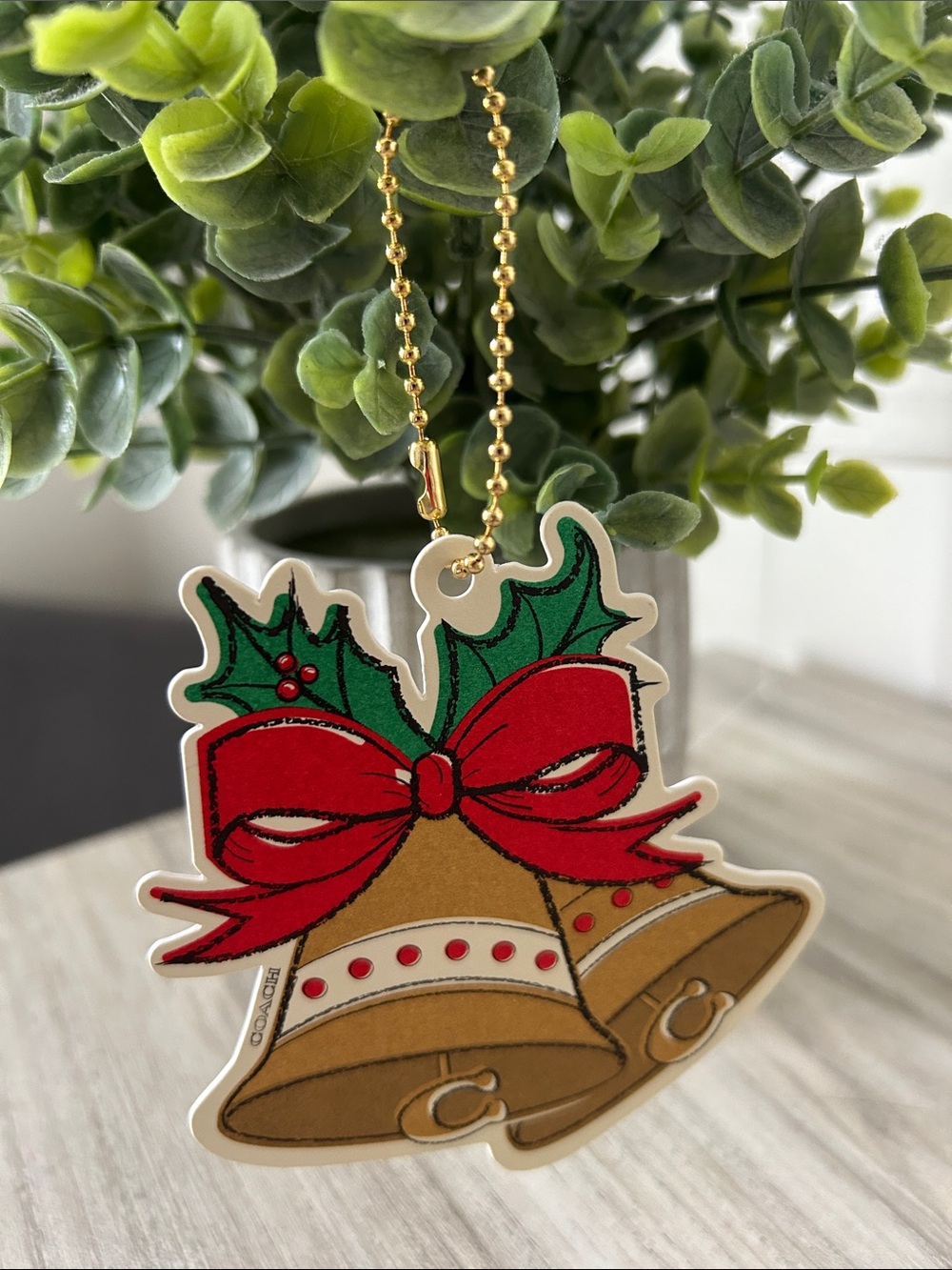 Coach Holiday Bell Ornament/gift tag with Red Bow and Brown Bells NWOT